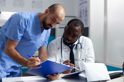 Doctor and nurse working at nurse