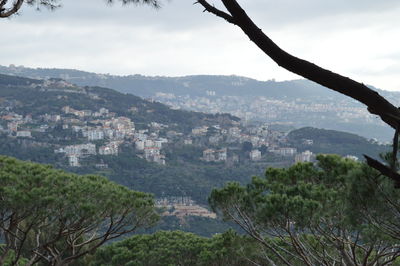 Cityscape with mountain range in background