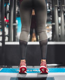 Low section of woman standing on floor