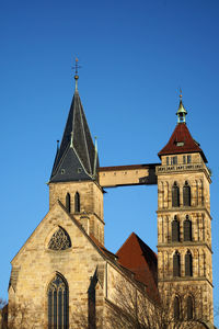 Low angle view of building against clear blue sky