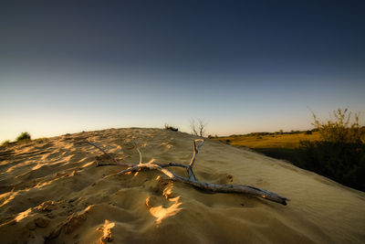 Scenic view of desert against clear sky