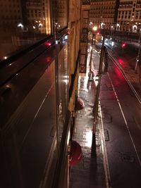 Vehicles on road in city at night