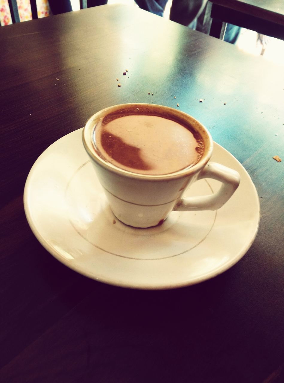 CLOSE-UP OF CAPPUCCINO ON TABLE