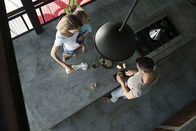Family preparing healthy breakfast in comfortable kitchen