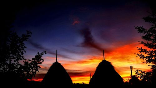 Silhouette temple against sky during sunset