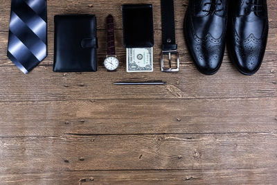 High angle view of shoes on wooden table