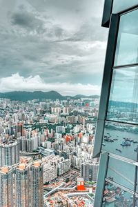 High angle view of city buildings against sky