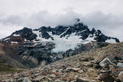 Cerro castillo mountain covered in clouds in chile, patagonia. 