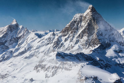 Scenic view of snowcapped mountains against sky. view from klein matterhorn, swiss alps