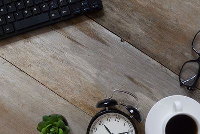 High angle view of clock on table