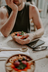 Midsection of woman having food