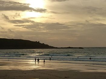 Scenic view of beach at sunset