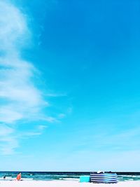 Scenic view of sea against blue sky