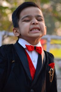 Close-up portrait of boy making a face