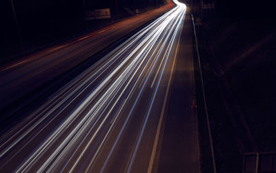 High angle view of light trails on road at night