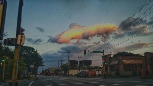 Road against cloudy sky at sunset