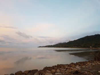 Scenic view of sea against sky at sunset