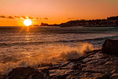 Scenic view of sea against sky during sunset