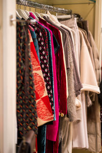 Clothes hanging in rack at store