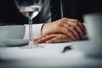 Close-up of man preparing food on table