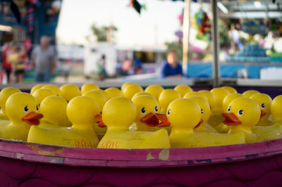 Rubber ducks in bucket in amusement park