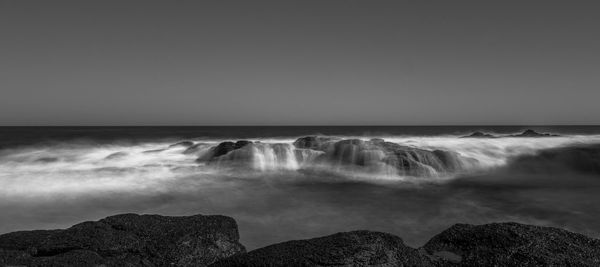 Scenic view of sea against clear sky