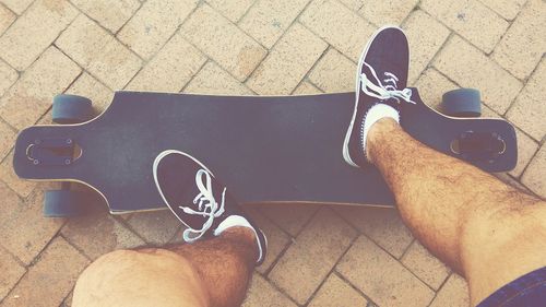 Low section of man with skateboard