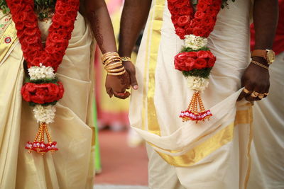 Midsection of woman wearing traditional clothing