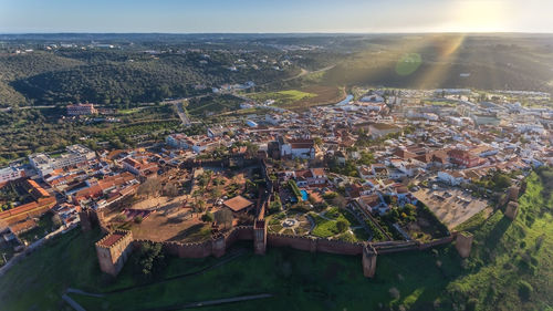 High angle view of townscape against sky in city