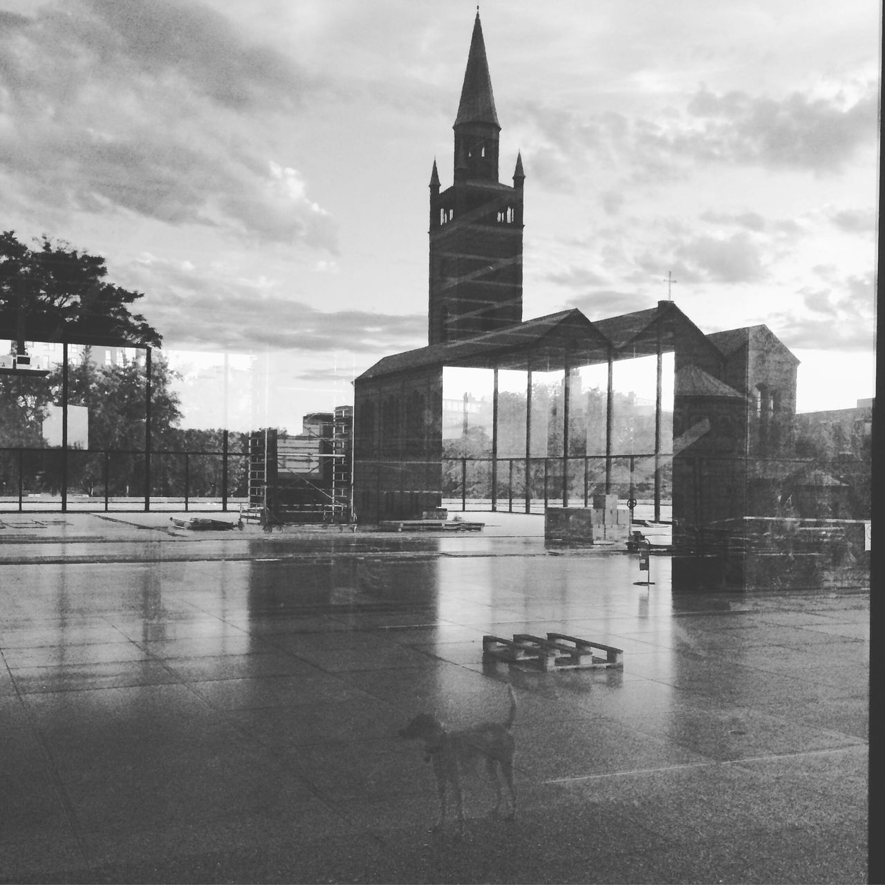 architecture, building exterior, built structure, sky, water, cloud, reflection, outdoors, in front of, cloud - sky, day, no people, cloudy, waterfront, facade, tall