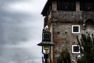 Low angle view of old building against sky