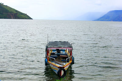 Boat in sea against sky