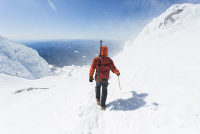 A man climbs down from the summit of mt. hood in oregon.