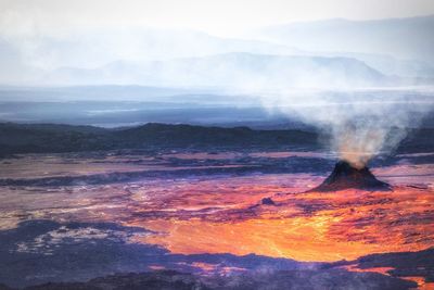 Scenic view of volcanic landscape against sky