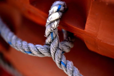 Close-up of rope tied on wood