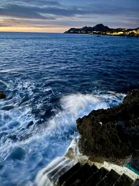 Scenic view of sea against sky during sunset