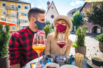 People on table at market stall