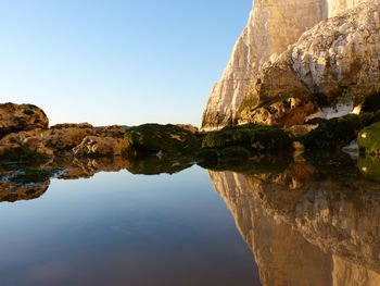 Low angle view of rock formation against sky