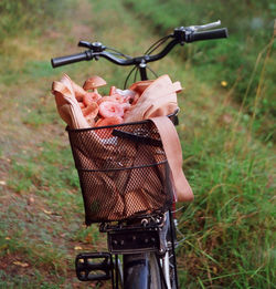 Bag with mushrooms in bicycle basket