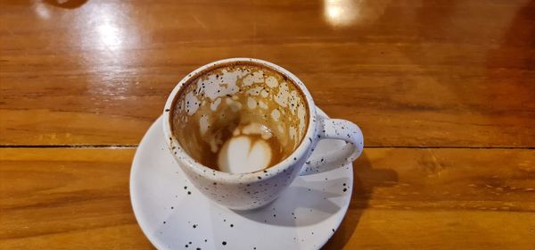 High angle view of coffee cup on table