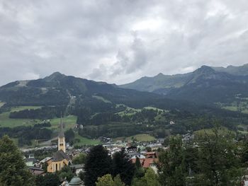 High angle view of townscape and mountains against sky
