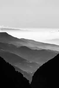 Scenic view of silhouette mountains against sky