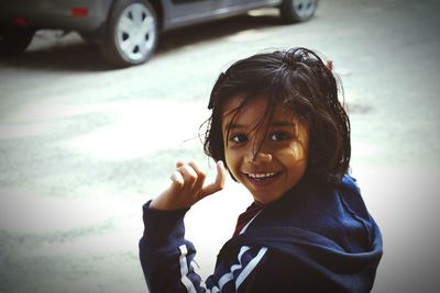 Portrait of smiling girl on street