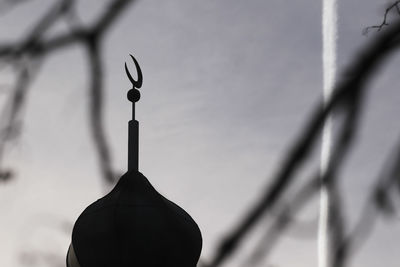 Close-up of metal fence against sky