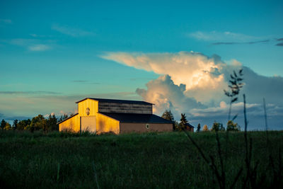 House on field against sky