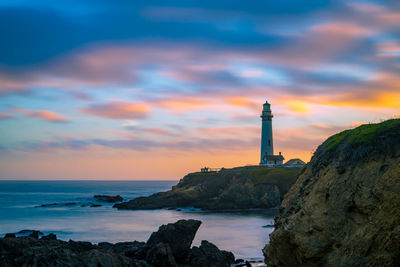 Scenic view of lighthouse at sunset