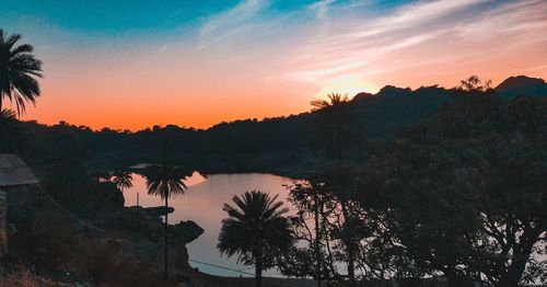 High angle view of silhouette trees against sky during sunset