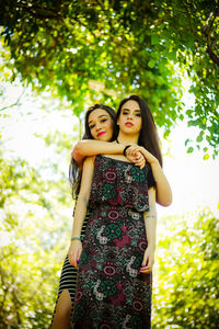 Beautiful young women standing at park