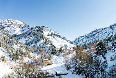 Beautiful rock mountains covered with snow in winter in sunny weather 