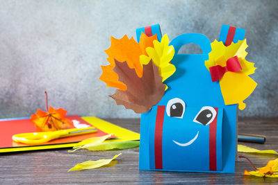 Close-up of multi colored paper toy on table